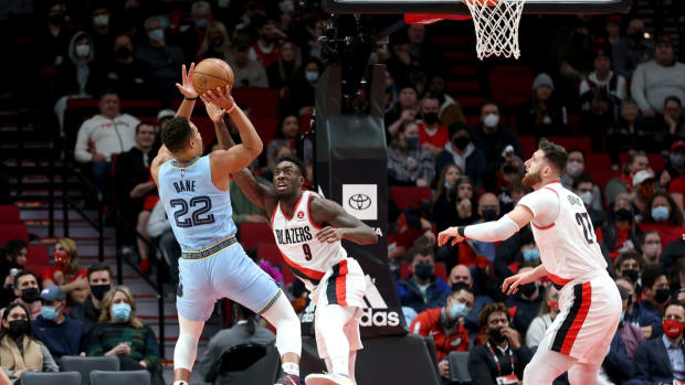 Dec 15, 2021; Portland, Oregon, USA; Memphis Grizzlies guard Desmond Bane (22) shoots over Portland Trail Blazers forward Nassir Little (9) in the first half at Moda Center. Mandatory Credit: Jaime Valdez-USA TODAY Sports